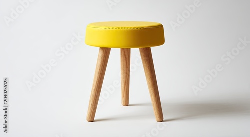 Minimalist Yellow Round Stool with Three Wooden Legs.