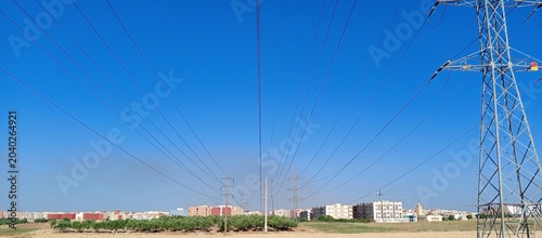 Tableau sur toile Tension lines run high under a blue sky in the outskirts of Morocco