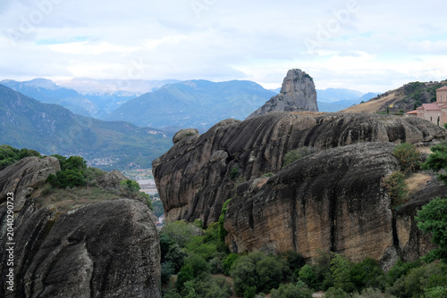 A view of the high, smooth rocks of Meteora on a cloudy day, Greece