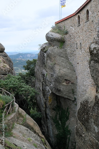 a deep gorge near the stone wall of the Meteora Monastery