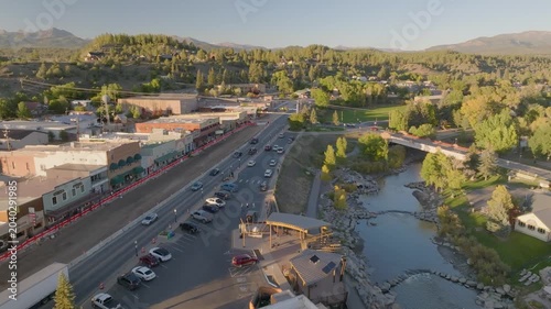Panoramic aerial view of San Juan River and Pagosa Springs, Colorado fall landscapes capturing autumn colors and natural scenery of San Juan Mountains at golden hour sunset - 4K Drone