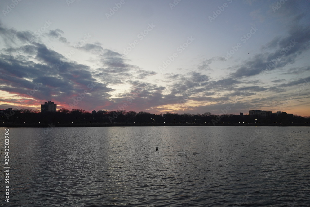 Fototapeta premium Sunset Lake Landscape with Clouds
