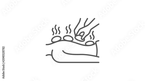 Foto Hands placing hot stones on back during massage therapy.