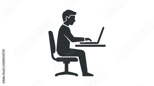 Professional man sits at a desk while typing on a computer to complete his daily corporate tasks in a clean office setting.