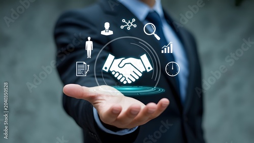 Businessman presenting virtual handshake icons for partnership agreement and collaboration in a professional setting with technology elements