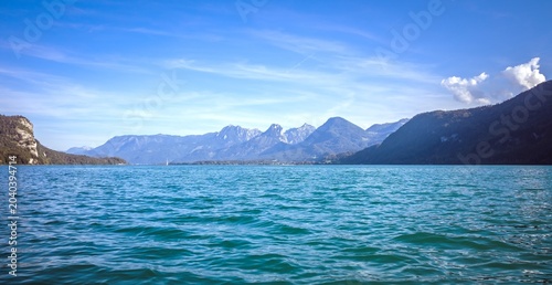 Breathtaking Alpine Lake View with Majestic Mountain Range and Clear Sky