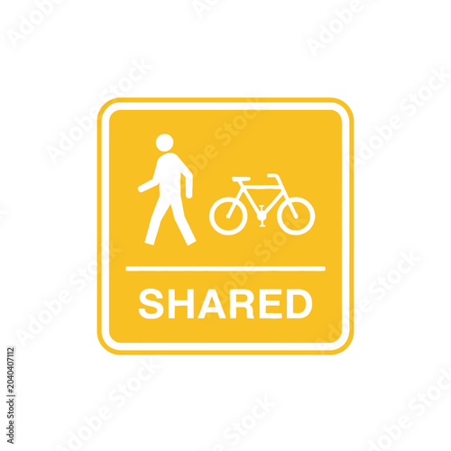 Shared path sign: Pedestrian and Bicycle lane symbol on yellow background.