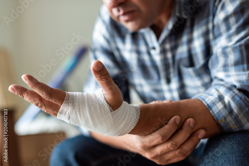 Canvas Print Injured hand with bandage care