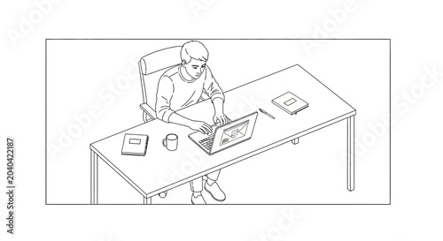 Young man working on a laptop at a desk in a minimalist office, focused and productive.