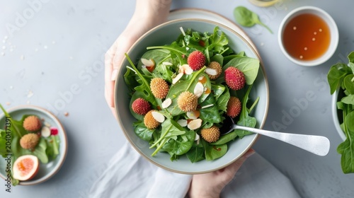 A vibrant salad with fresh lychees, mixed greens, almonds, and honey-lime vinaigrette.