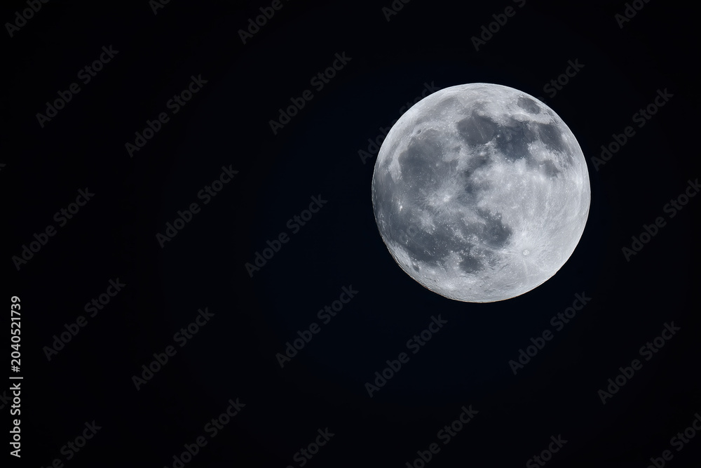 Fototapeta premium full moon on black isolated background, copy space