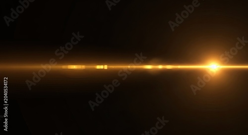 Golden Lens Flare on Black Background.