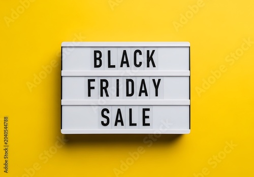 Black friday sale sign on yellow background lightbox