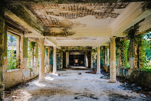 Photos Overgrown corridor of abandoned Soviet Bathhouse #5 in Tskaltubo, Georgia, where nature slowly reclaims the once-grand spa