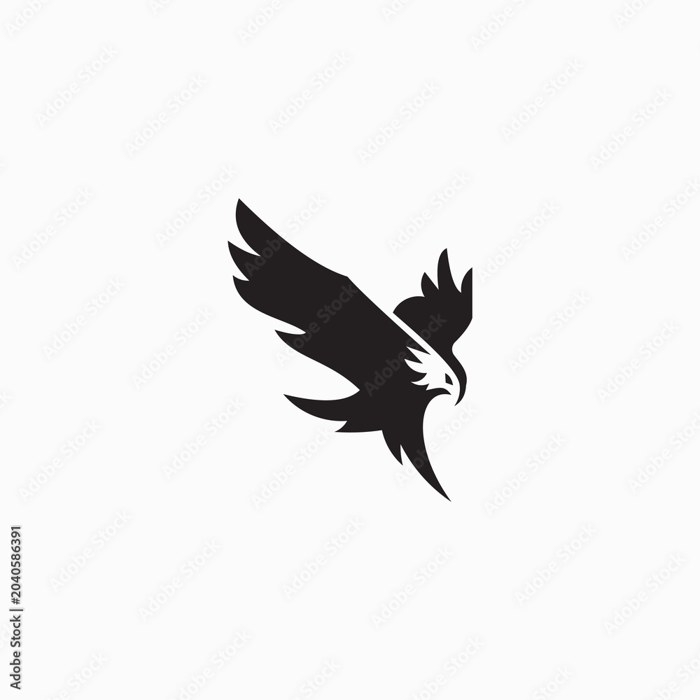 Fototapeta premium This logo features a minimalist silhouette of an eagle swooping or flying with its wings spread.