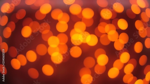 Warm orange circles on dark background bokeh light