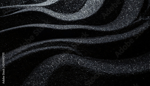 Abstract shimmering silver glitter swirls on black background, elegant dust particles flowing like liquid waves, luxury party or celebration concept