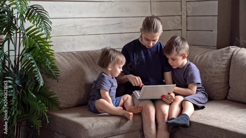 Family memories shared. Sisters recalling childhood stories within warm family surroundings. Cherished family memories unfold as siblings share stories and reminisce in cozy home environment