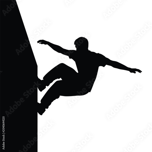 man climbing a steep cliff face