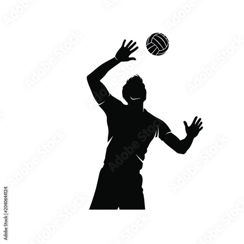 man in silhouette hitting a volleyball