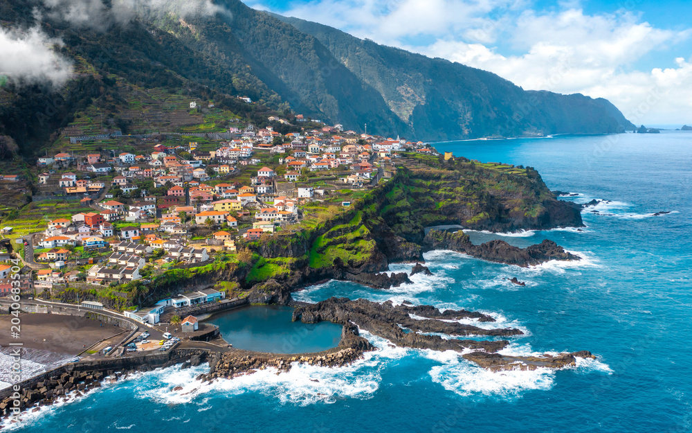 Obraz premium Aerial view of Madeira island. Land meets ocean in Seixal, Madeira, Portugal