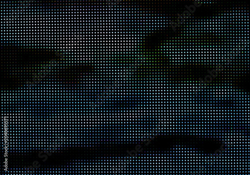 Close up of a dark screen with small blue and white dots arranged in a grid pattern creating a digital or technological background texture