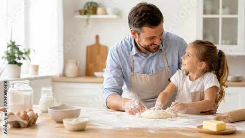 Father daughter kitchen baking dough flour family apron home smile Warm father daughter moment bright kitchen as they baking dough together wooden table, flour hands and apron, cozy family home