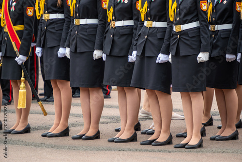 Quadro em tela several female service members or cadets standing closely in a formal parade lin