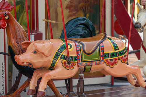 Photos Vintage carousel pig ride at traditional fairground