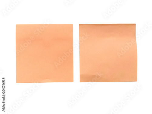 Two plain orange sticky notes side by side