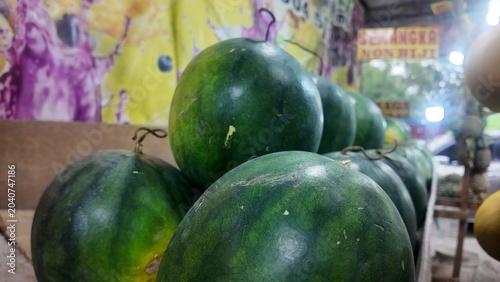 Photo of fresh watermelons at a fruit market
