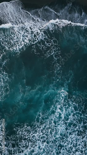 Aerial view of black beach with foam waves Atlantic beach. Sea ocean waves reaching shore