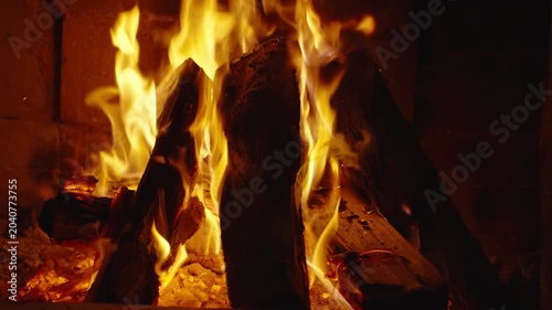 Wood burning in a cozy fireplace at home 4k footage