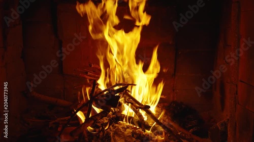 Wood burning in a cozy fireplace at home 4k footage