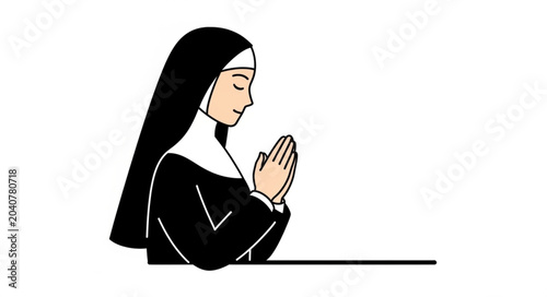 Photos Nun praying with hands clasped in devotion.