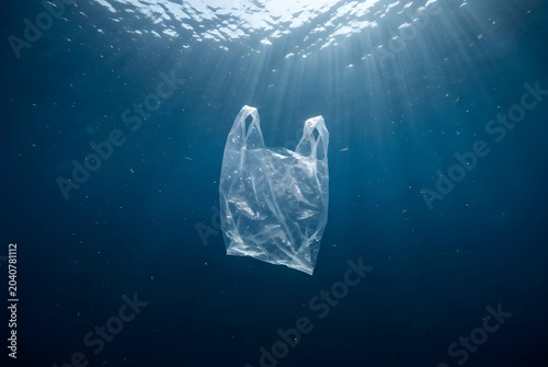 Plastic bag floating beneath the ocean surface