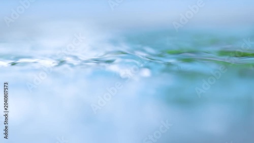 Close-up of raindrops falling on the water surface