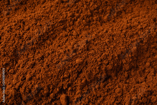 Cocoa powder as a background. Top view.