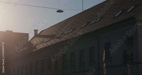 Historic building facade illuminated by sunset light in Zagreb Croatia.