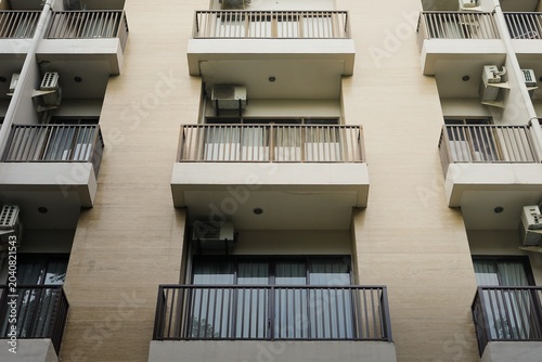 Canvas Print Low angle view of apartment building balconies with railings