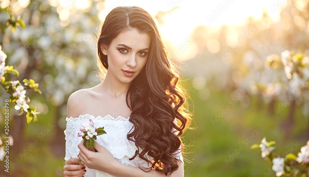 Naklejka premium Woman blossoms sunshine