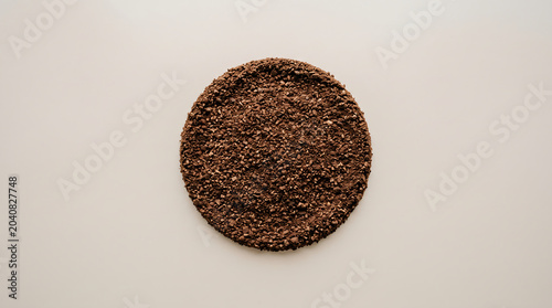Close-up shot of fresh ground coffee powder on a surface