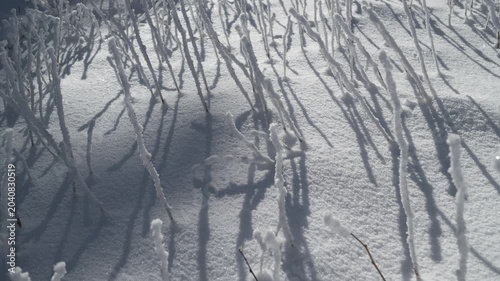 Moving shadows on the snow, time lapse.
