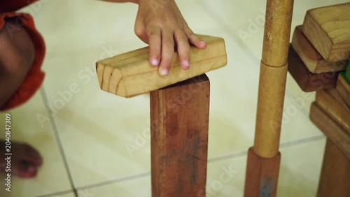 Wooden blocks building tower motion video showing creative child playing activity