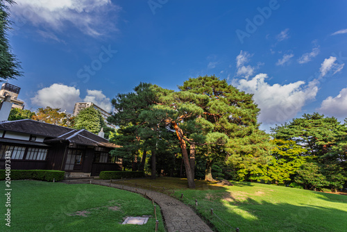 Fotografija Traditional Japanese house and beautiful pine trees in Tonogayato Gardens Septem