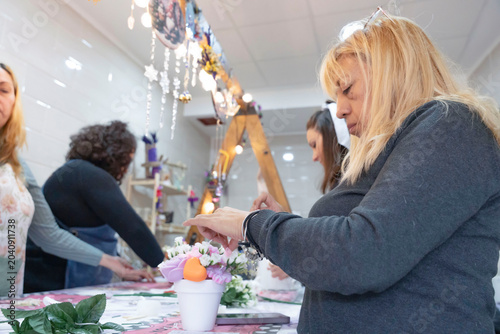 Bild auf Leinwand Women creating handmade candles at workshop