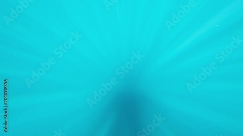 Azure calm water with sunbeams. Underwater scuba diving with the visible sun rays. Shallow water with sunrays. Travel footage, sun underwater.