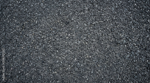 Dark Gray Asphalt Road Texture Close Up Rough Bitumen Pavement Surface with Small Grainy Stones for Construction and Industrial Backgrounds