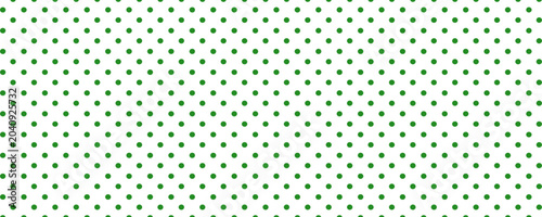 Green polka dot seamless pattern on white background. Polka dot background. Dotted cute pattern.