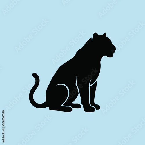 Photography A black silhouette of a large wild cat sitting down calmly